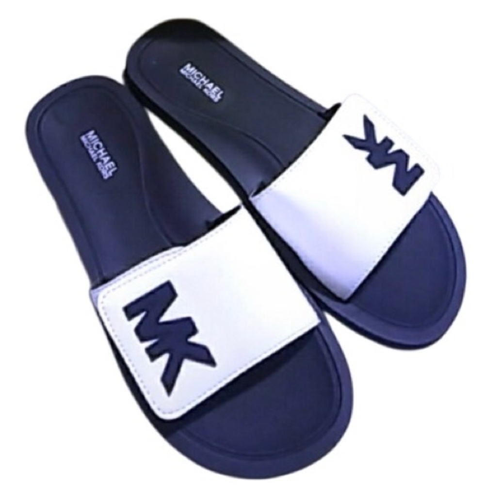 Michael Kors slides, unknown size I believe it’s a 4 or 5 in kids will measure